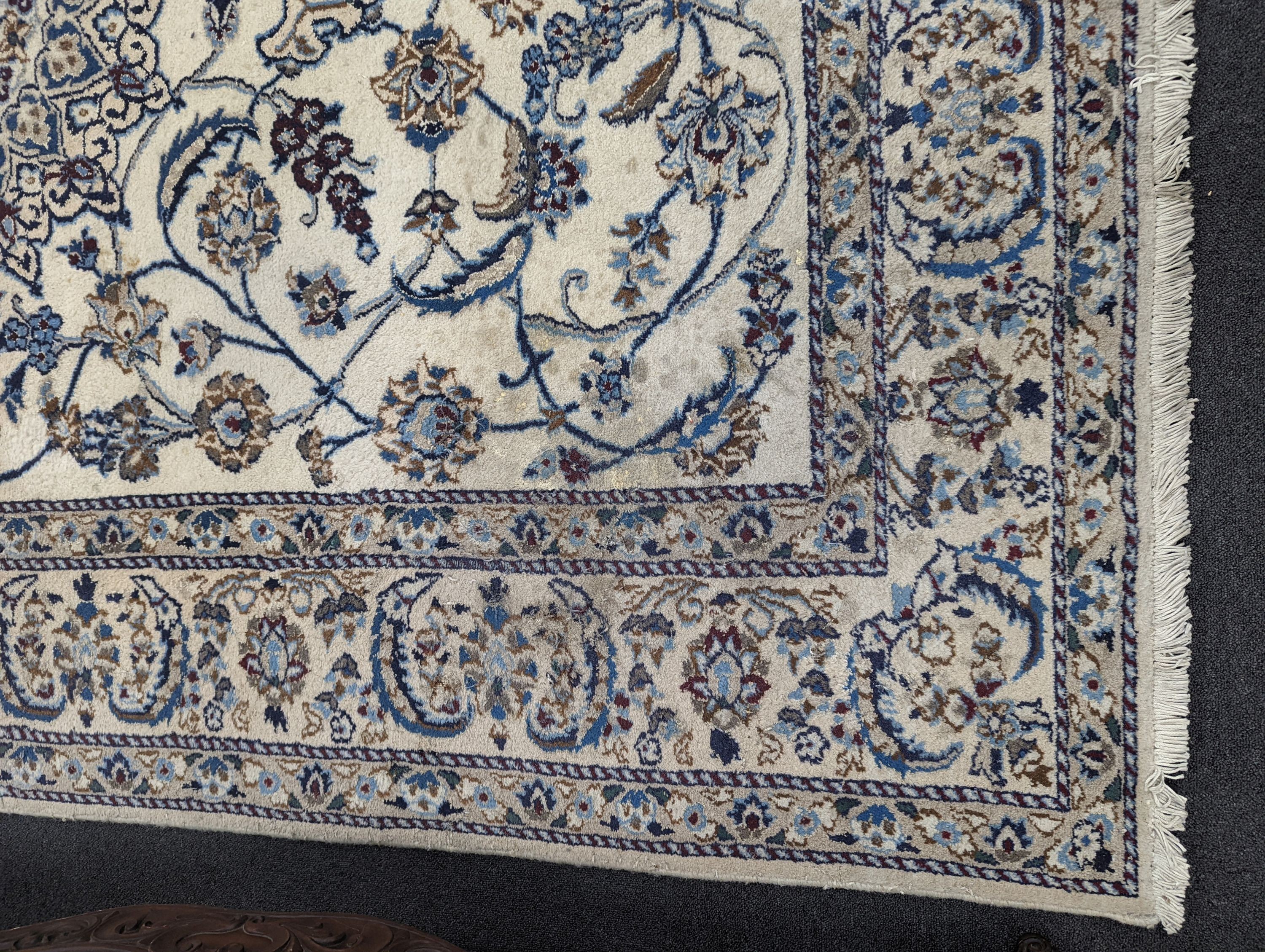 An ivory ground Nain carpet, 290 x 205cm